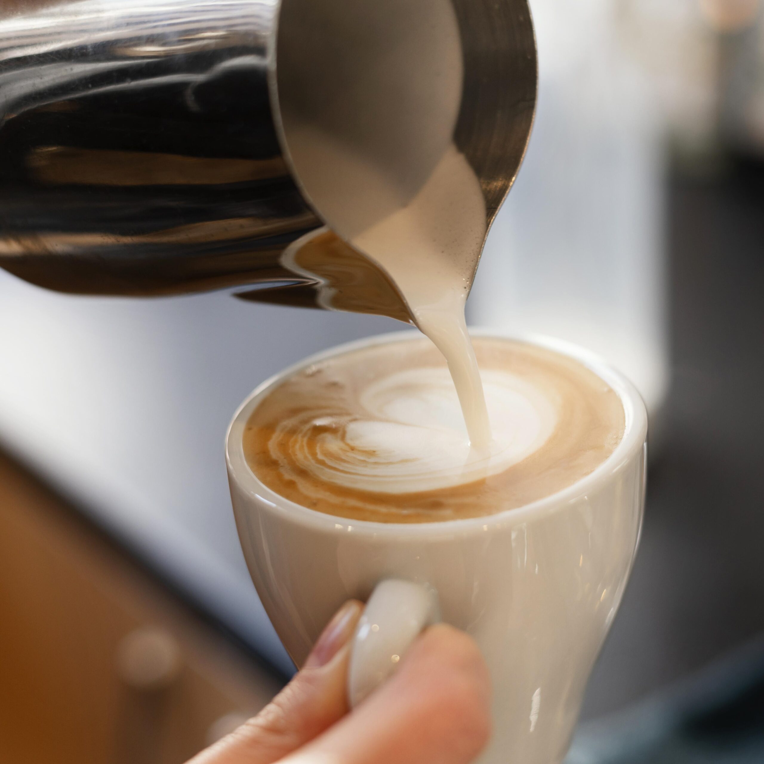 Close Up Hand Holding Coffee Cup